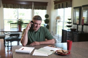 Man on the phone reviewing moving information