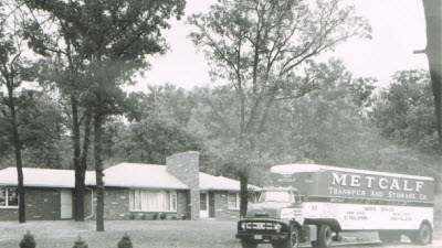 Historic Metcalf Moving Truck in front of house