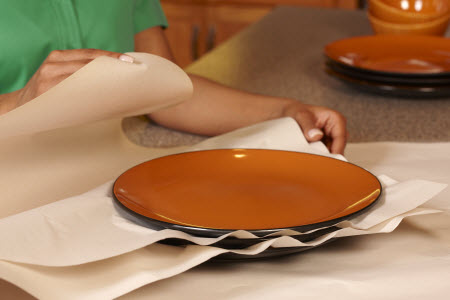 plates being wrapped for moving box